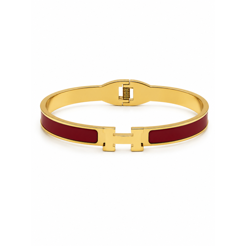 Brazalete rígido de diseño moderno con detalles esmaltados y acabado premium.