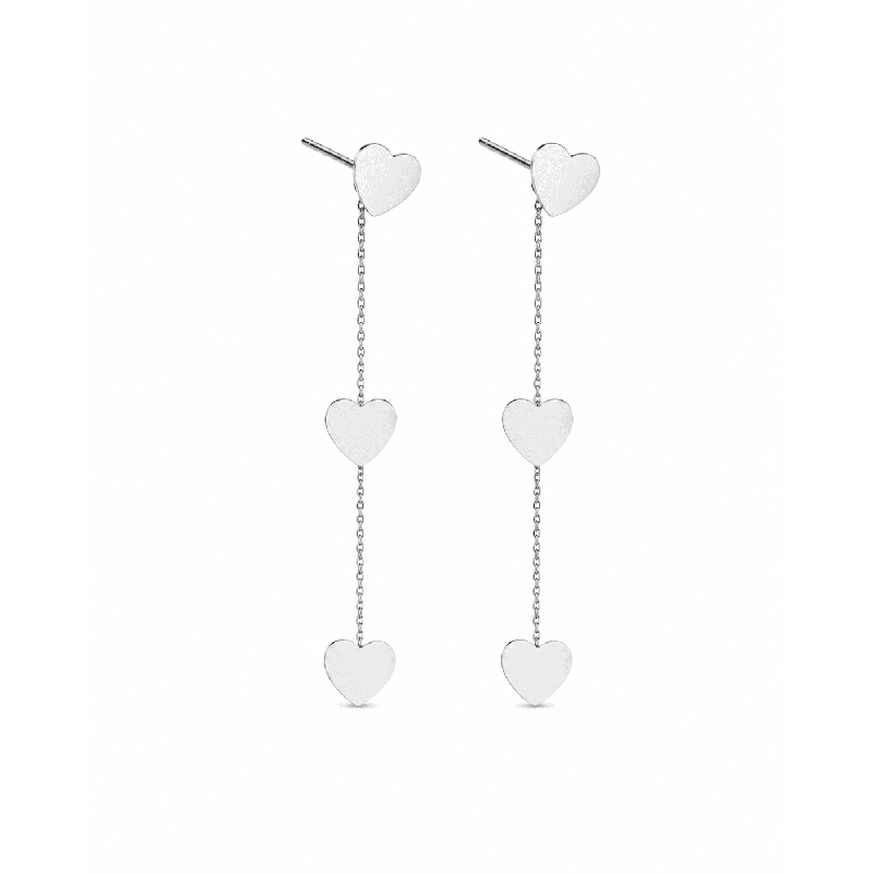 Pendientes colgantes con delicados corazones y acabado brillante premium. Inspirados en tendencias modernas y románticas.