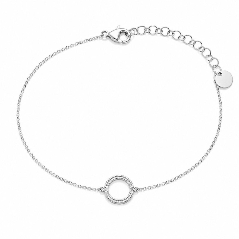 Pulsera delicada con círculo texturizado y diseño minimalista premium.