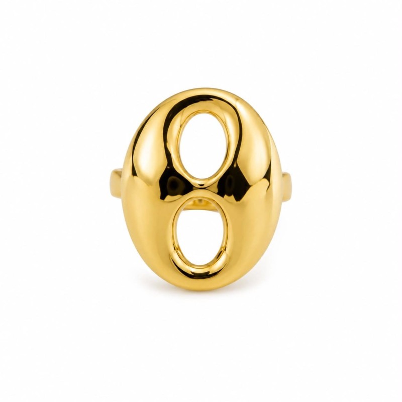 Anillo de diseño escultórico y contemporáneo que destaca por su elegante silueta ovalada con doble abertura central.