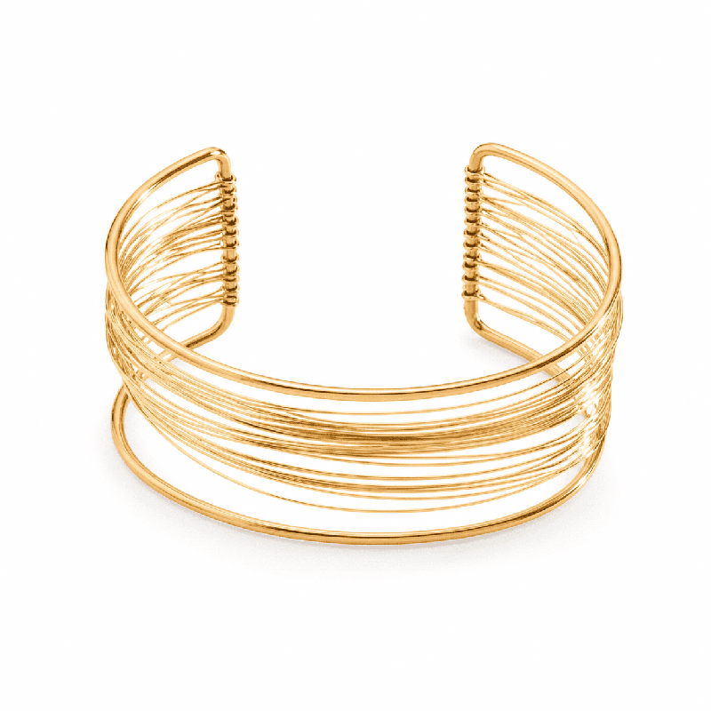 Brazalete de diseño moderno y sofisticado compuesto por múltiples líneas finas entrelazadas color dorado