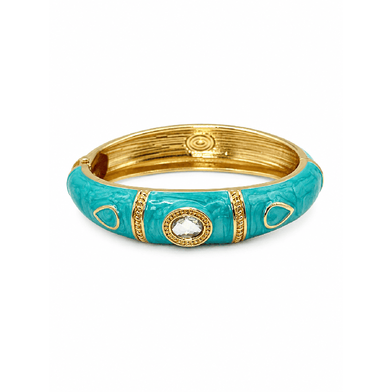 Añade un toque de sofisticación atemporal a tu look con este espectacular brazalete rígido color turquesa